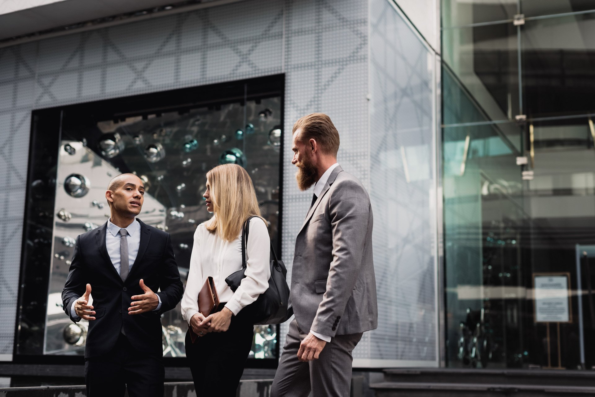 business-people-talking-outside-office business-people-talking-outside-office